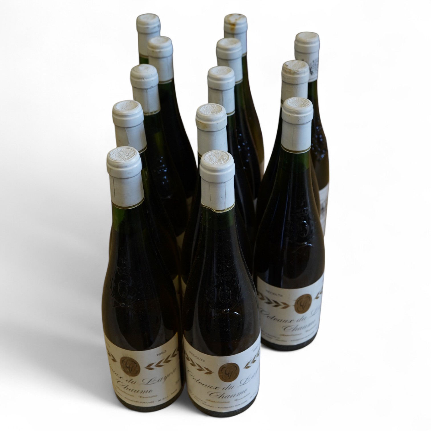 Eleven bottles of 1983 Chateau Du Layon Chaume, one 1985 bottle and one 1993 Chatueau de Bellevue Coteaux du Layon